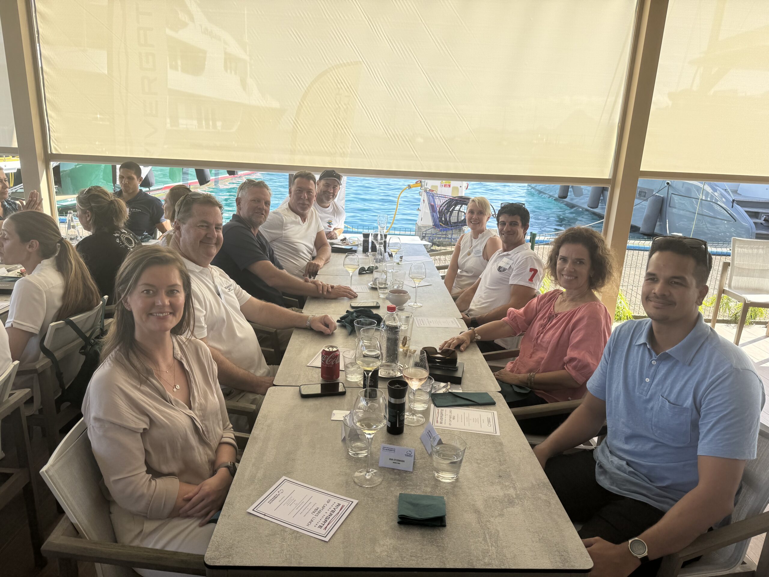 Table at the Rivergate Marina & Shipyard Captain’s Lunch, mix of Aussie members, local Tahitian indu